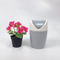 Round design small desk bin with swing lid